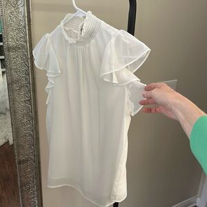 Sleeveless ruffle cap sleeve white top